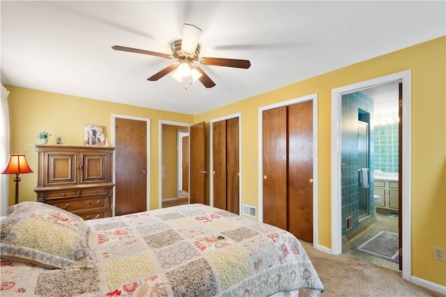 1805 Educational Dr, White Oak, PA 15131 - bedroom featuring visible vents, two closets, ceiling fan, connected bathroom, and light colored carpet