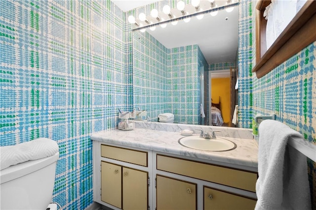 1805 Educational Dr, White Oak, PA 15131 - bathroom featuring vanity, wallpapered walls, and toilet