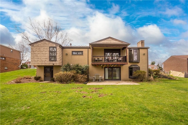 1805 Educational Dr, White Oak, PA 15131 - rear view of house featuring a patio, a chimney, stucco siding, and a lawn