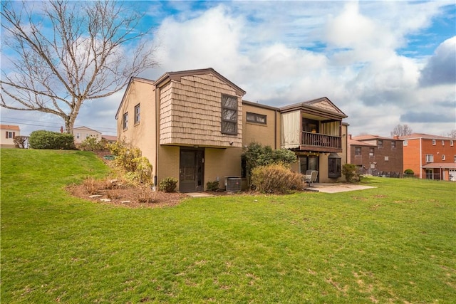 1805 Educational Dr, White Oak, PA 15131 - back of property with central AC, mansard roof, a lawn, a balcony, and brick siding