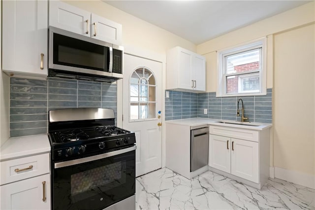 3032 Churchview Ave, Brentwood, PA 15227 - kitchen featuring a healthy amount of sunlight, light countertops, appliances with stainless steel finishes, and a sink