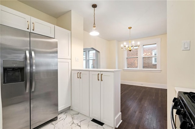 3032 Churchview Ave, Brentwood, PA 15227 - kitchen with black gas range oven, baseboards, an inviting chandelier, a peninsula, and stainless steel fridge
