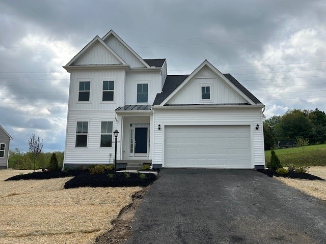 116 Fox Water Trl, Beaver, PA 15009 - view of front of home with a garage, board and batten siding, a standing seam roof, driveway, and metal roof