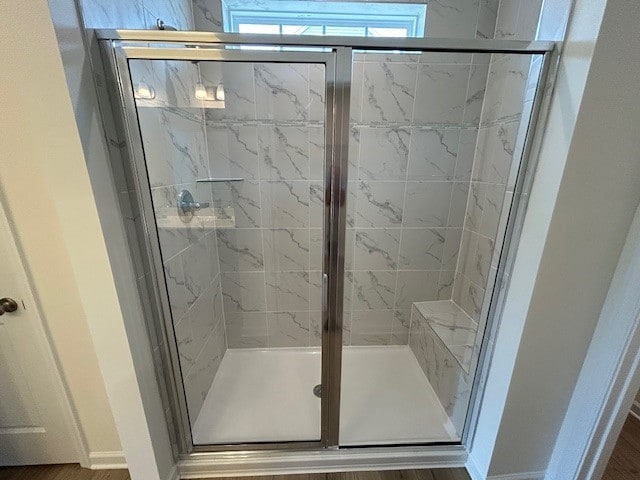 full bathroom with a shower stall
