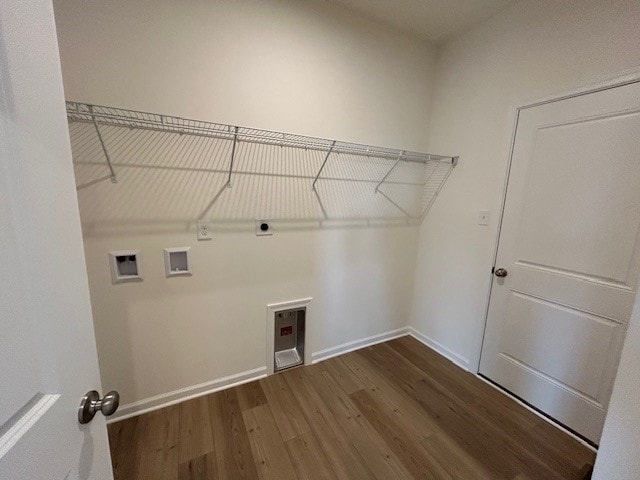 washroom featuring washer hookup, hookup for an electric dryer, laundry area, dark wood-style flooring, and baseboards