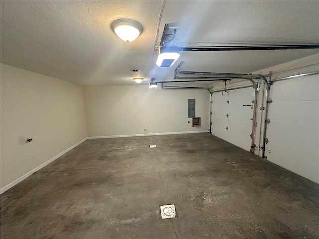 garage with electric panel, baseboards, and a garage door opener