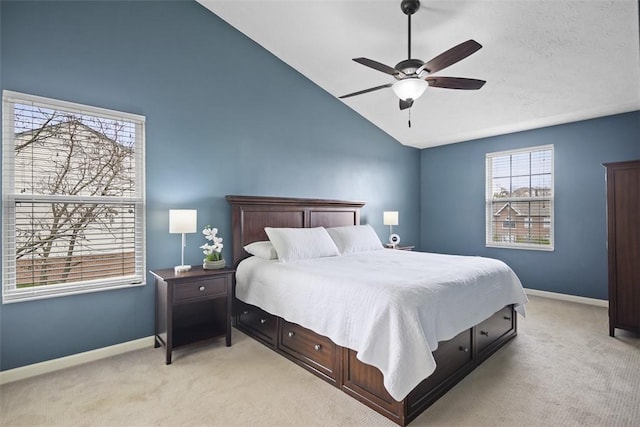 bedroom with light carpet, high vaulted ceiling, baseboards, and a ceiling fan