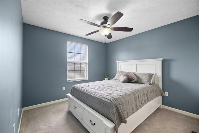 bedroom featuring carpet flooring, baseboards, and ceiling fan