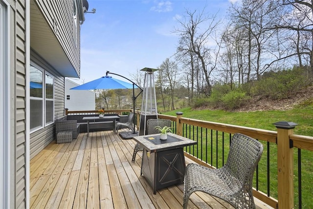 deck featuring a yard and an outdoor hangout area
