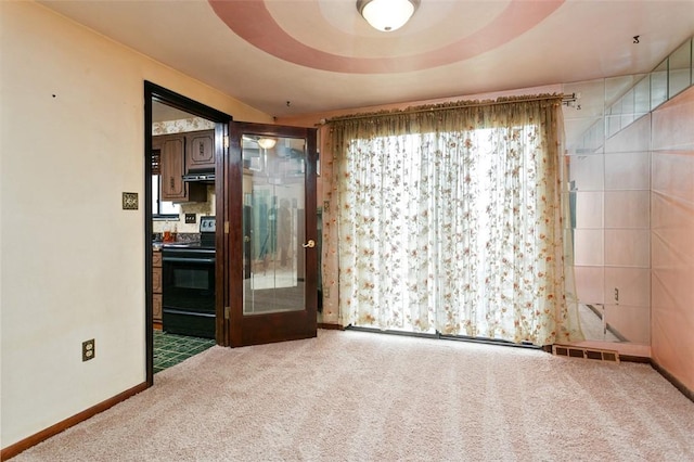 unfurnished room with baseboards, visible vents, and carpet floors