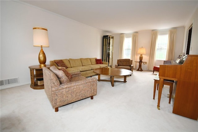 living area with light carpet, crown molding, and visible vents