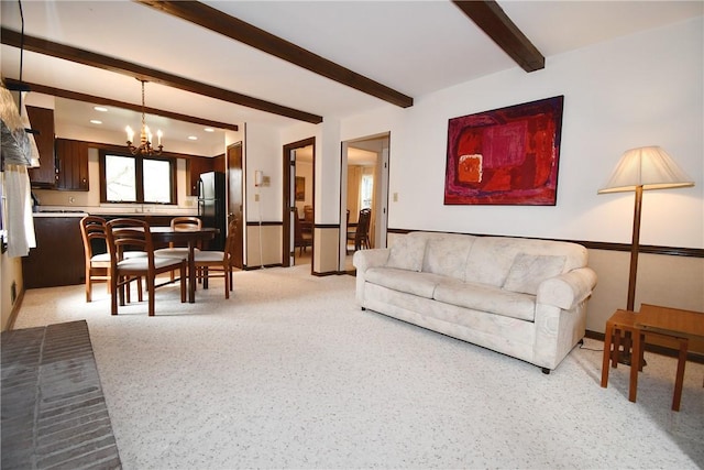 living area with a chandelier, beamed ceiling, and recessed lighting