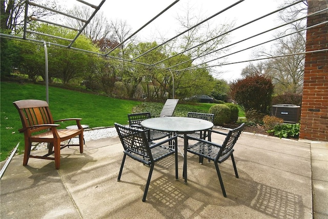 view of patio featuring central AC and outdoor dining area