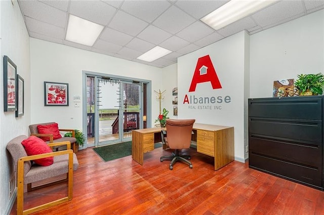 office featuring a drop ceiling and wood finished floors