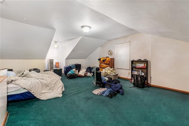 carpeted bedroom with baseboards and vaulted ceiling