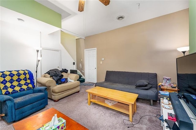 living room featuring ceiling fan, visible vents, and carpet floors