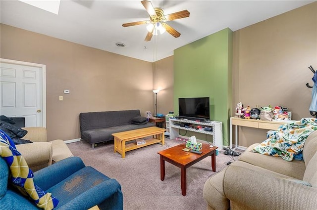living area with ceiling fan, baseboards, carpet flooring, and visible vents