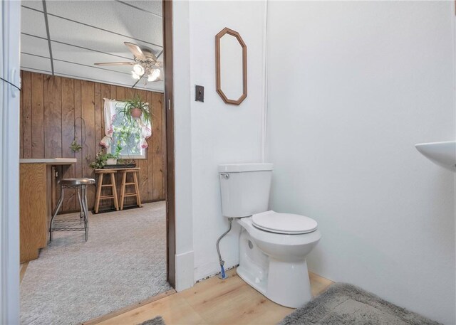 103 Timblin, Clay Twp, PA 16001 - bathroom featuring wood walls, ceiling fan, toilet, and wood finished floors