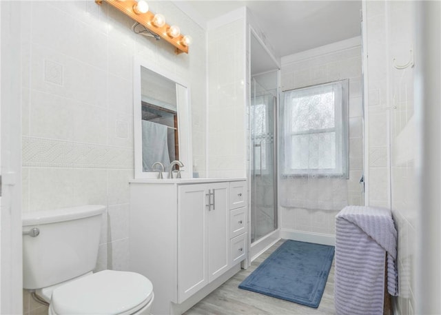 103 Timblin, Clay Twp, PA 16001 - full bath featuring toilet, a stall shower, vanity, wood finished floors, and tile walls