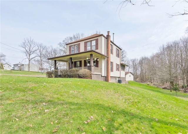 103 Timblin, Clay Twp, PA 16001 - view of front of house with a porch, a front lawn, and a chimney