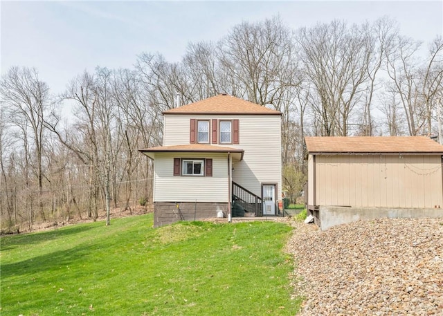 103 Timblin, Clay Twp, PA 16001 - view of front of property with a front yard, an outdoor structure, and roof with shingles