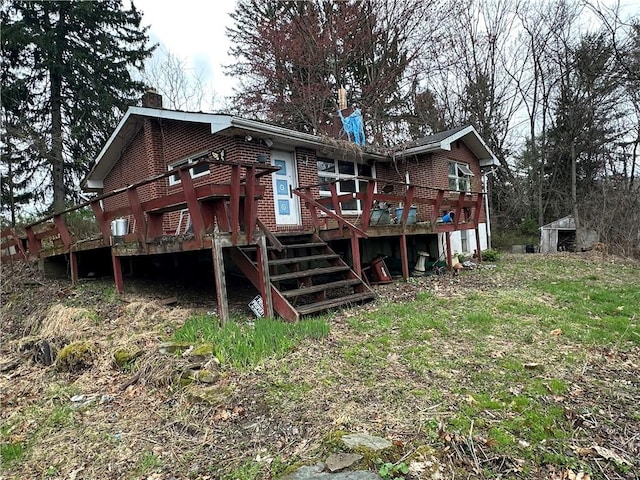 3950 Dunnett Ln, Murrysville, PA 15668 - rear view of house with a deck, a chimney, stairway, an outdoor structure, and brick siding