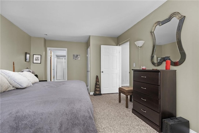 carpeted bedroom featuring baseboards