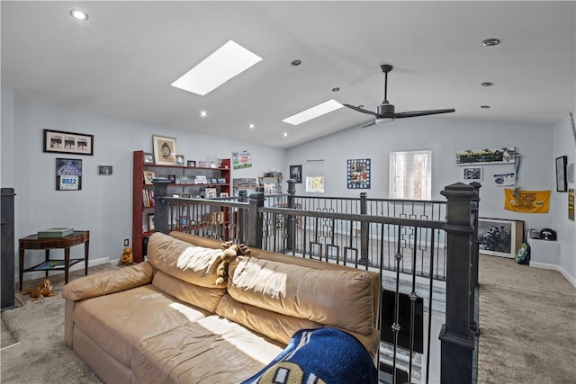 living room with carpet, a ceiling fan, recessed lighting, baseboards, and lofted ceiling with skylight