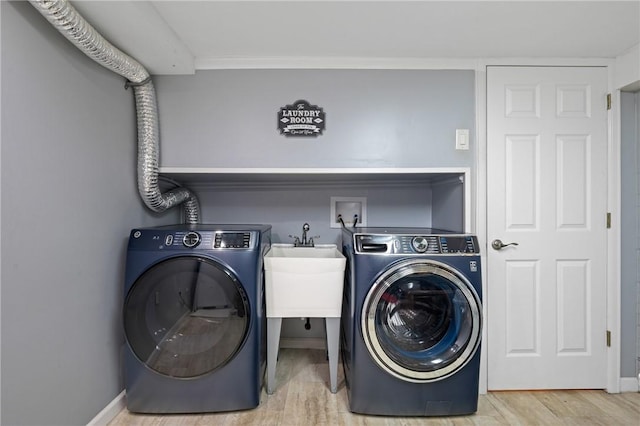 6429 Bartlett St, Squirrel Hill, PA 15217 - washroom with laundry area, wood finished floors, baseboards, and washer / dryer