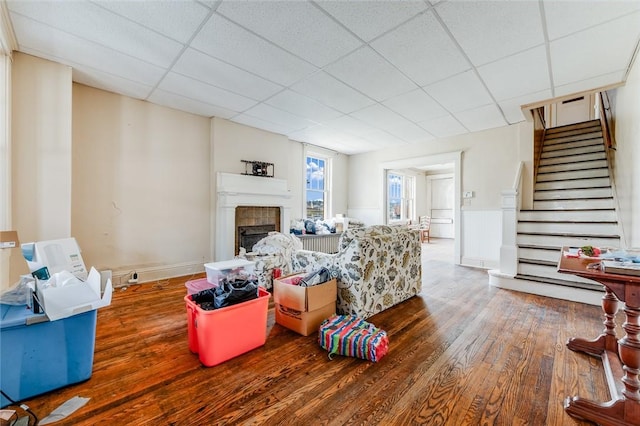 43-45 Union St, Uniontown, PA 15401 - living area featuring a paneled ceiling, wood finished floors, a fireplace, and stairs