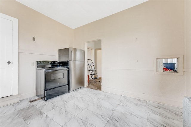 43-45 Union St, Uniontown, PA 15401 - kitchen featuring baseboards, freestanding refrigerator, and electric range