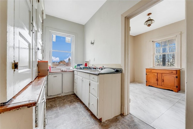43-45 Union St, Uniontown, PA 15401 - kitchen with white cabinets and a sink