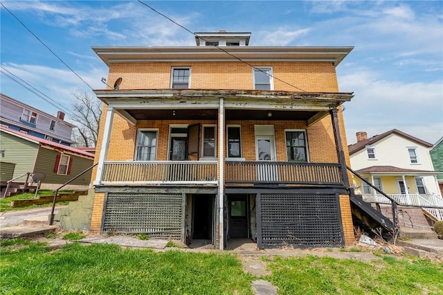 43-45 Union St, Uniontown, PA 15401 - rear view of property with brick siding, a porch, and stairs
