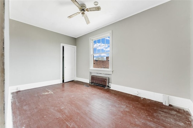 43-45 Union St, Uniontown, PA 15401 - unfurnished bedroom featuring a closet, baseboards, radiator, ceiling fan, and wood finished floors