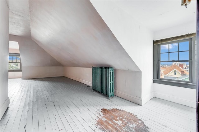 43-45 Union St, Uniontown, PA 15401 - additional living space with hardwood / wood-style flooring, baseboards, radiator, and lofted ceiling