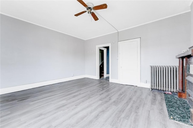 43-45 Union St, Uniontown, PA 15401 - interior space with baseboards, ornamental molding, a ceiling fan, wood finished floors, and radiator heating unit