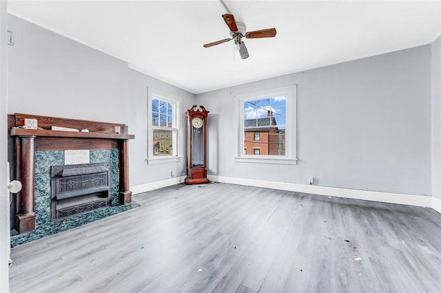 43-45 Union St, Uniontown, PA 15401 - unfurnished living room featuring baseboards, ceiling fan, wood finished floors, and a fireplace