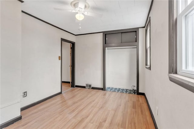 2444 Dewey St, Homestead, PA 15120 - unfurnished bedroom with visible vents, light wood finished floors, and multiple windows