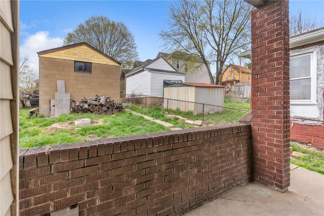 2444 Dewey St, Homestead, PA 15120 - view of patio featuring an outbuilding and a storage unit