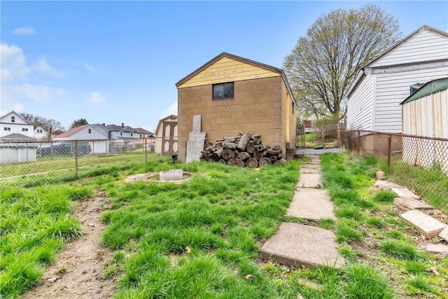 2444 Dewey St, Homestead, PA 15120 - view of yard with a fenced backyard, an outdoor structure, and a storage unit