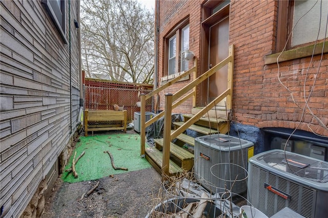 1415 Lager St, Troy Hill, PA 15212 - exterior space with central AC unit and brick siding