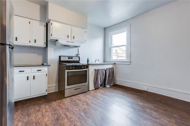 1415 Lager St, Troy Hill, PA 15212 - kitchen with white cabinets, appliances with stainless steel finishes, under cabinet range hood, baseboards, and dark wood-style floors