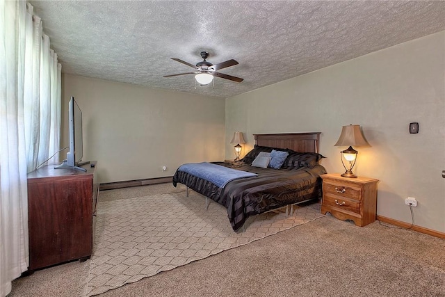 carpeted bedroom with ceiling fan, a textured ceiling, a baseboard heating unit, and baseboards