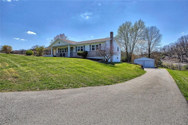 single story home featuring an outdoor structure, a chimney, a front yard, a garage, and fence