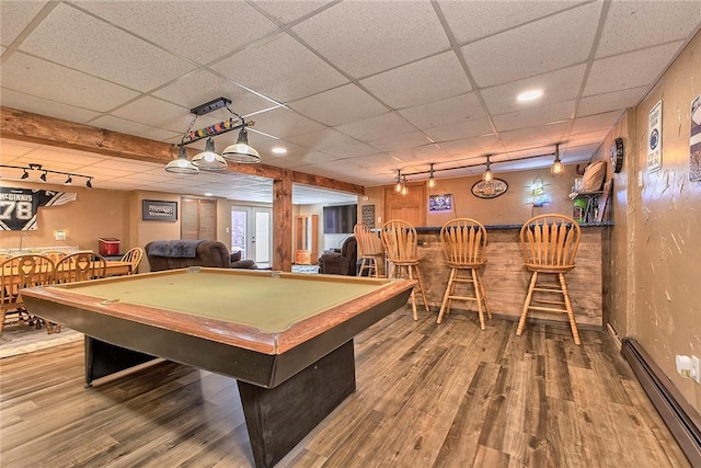 game room with pool table, a baseboard radiator, a dry bar, and wood finished floors