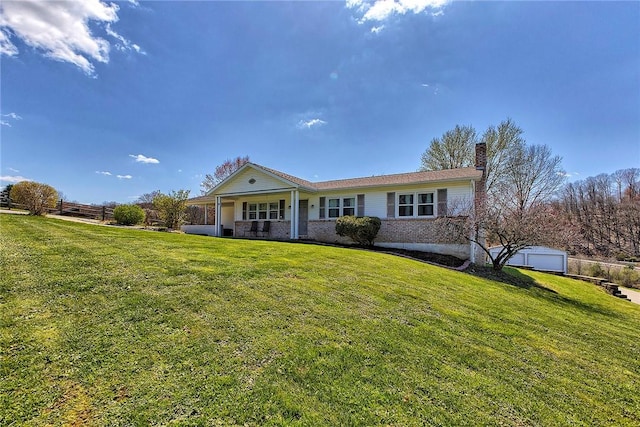 view of front of home featuring a chimney, a front lawn, and covered porch