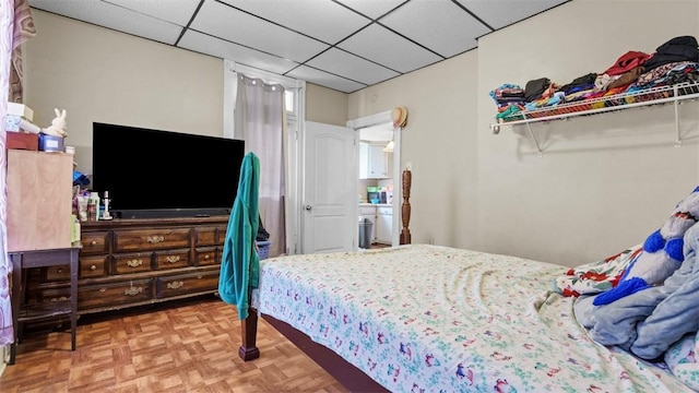 bedroom with a drop ceiling