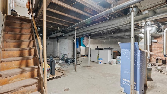 unfinished basement featuring washer and dryer