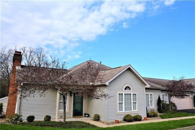 513 Madison Blvd, New Sewickley Twp, PA 15042 - view of front of house with a garage, aphalt driveway, a chimney, and a shingled roof