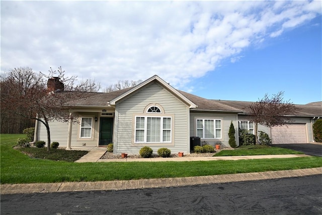513 Madison Blvd, New Sewickley Twp, PA 15042 - ranch-style home featuring a front lawn, a garage, and aphalt driveway